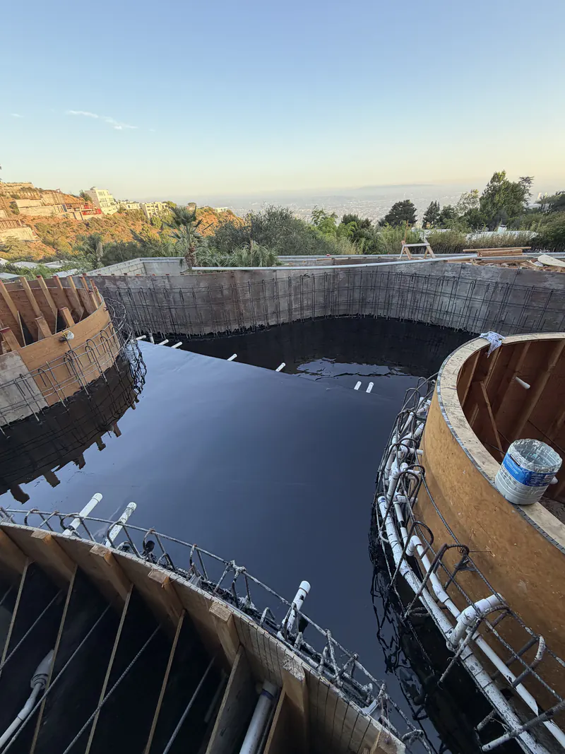 Flood test holding water on a completed below grade waterproofing membrane above the Pacific